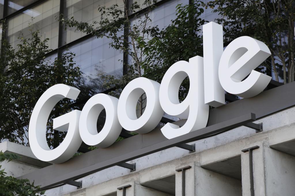 The Google sign is shown over an entrance to the company's new building in New York