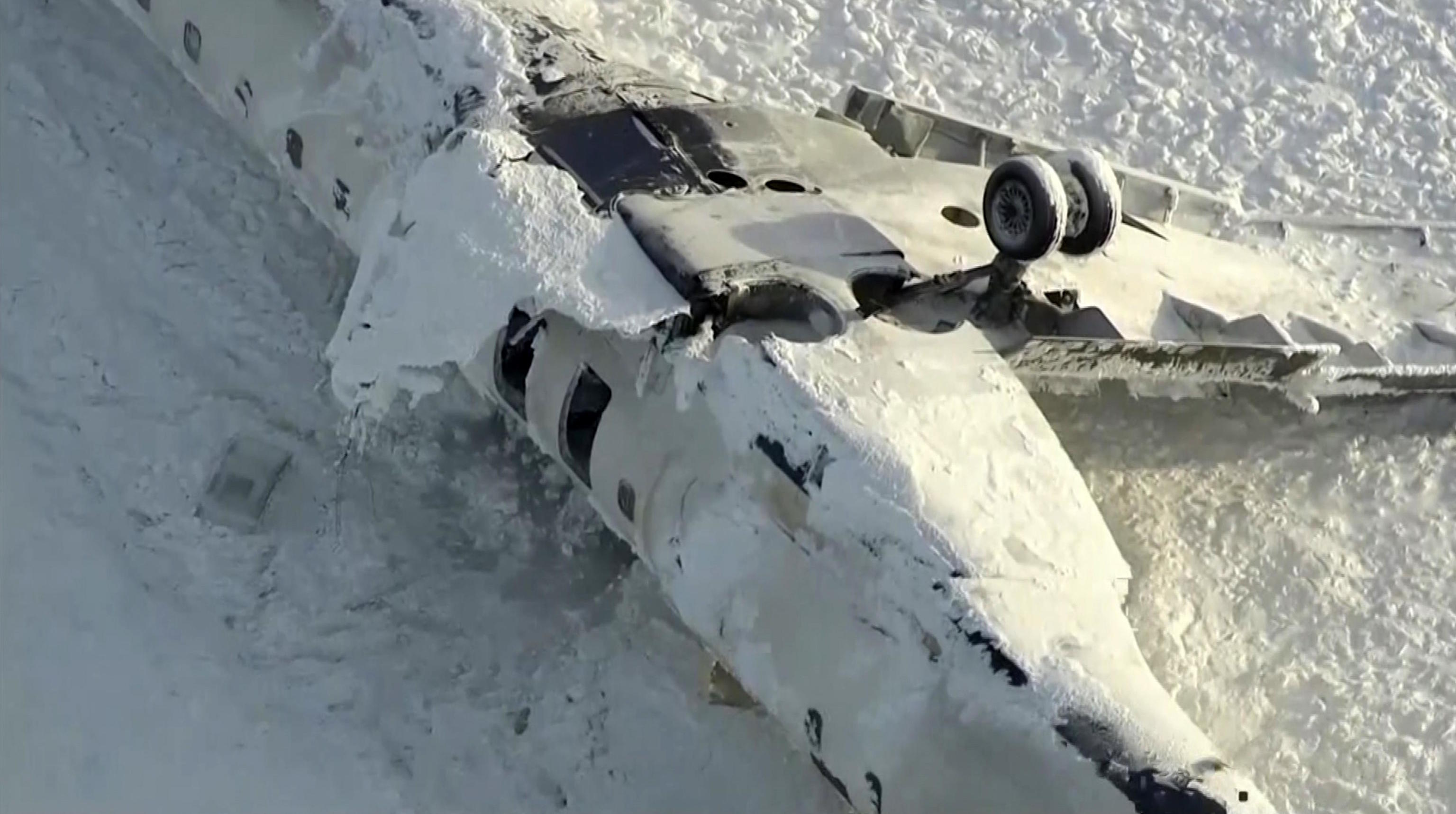 Aerial view of the overturned plane at Toronto Pearson Airport.