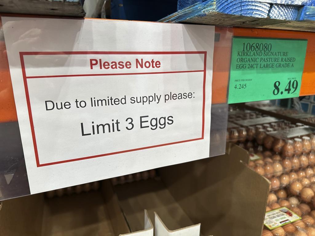 A sign notes the limitation on the purchase of flats of eggs in a Costco warehouse