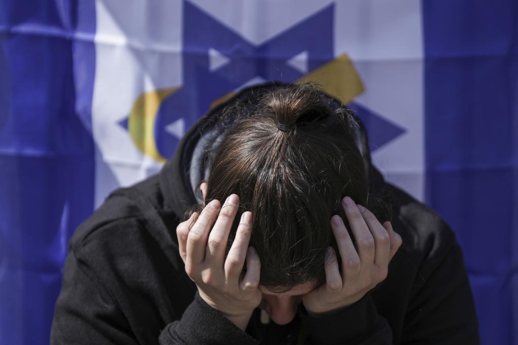 A woman reacts at the so-called 'Hostages Square' in Tel Aviv, Israel