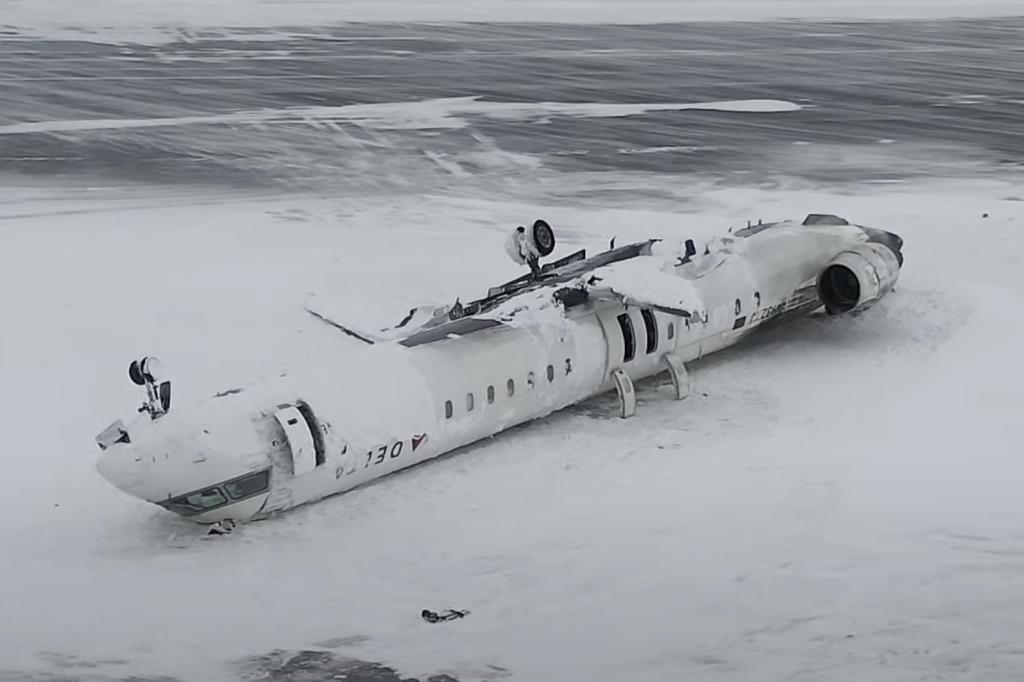 The crashed plane of Delta flight 4819 at Toronto Pearson International Airport