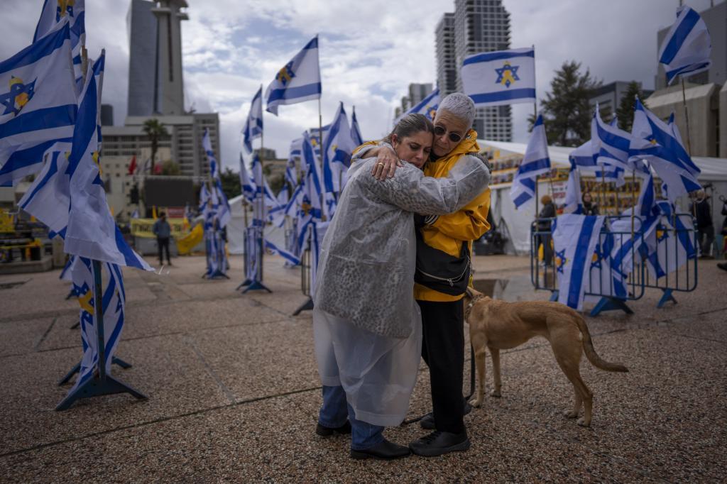 People react at the so-called 'Hostages Square' in Tel Aviv