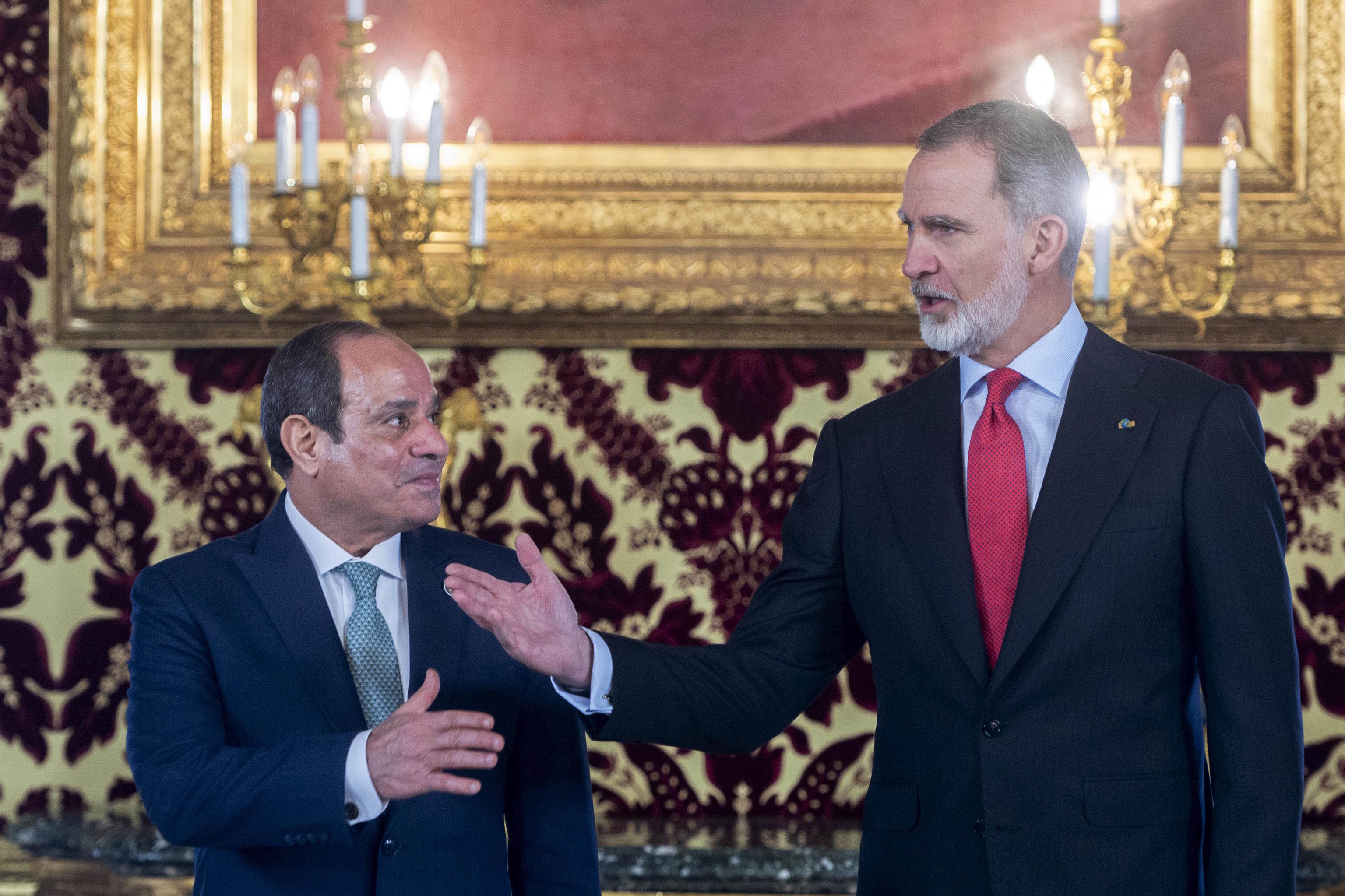 Spain's King Felipe VI, right, gestures next to Egyptian President Abdel Fattah el-Sisi.