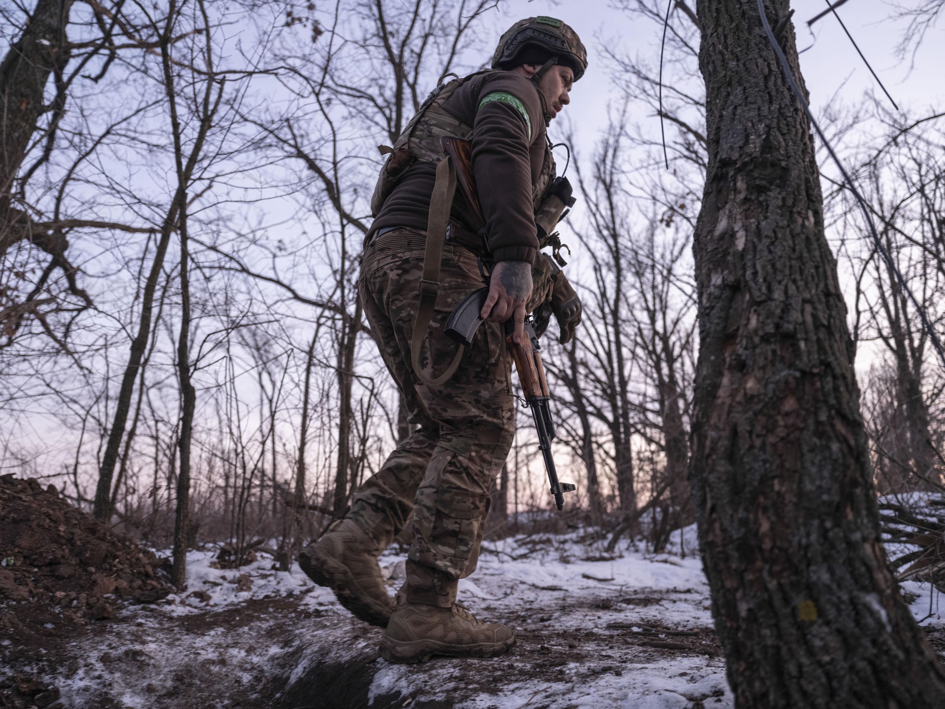 A Ukrainian soldier passes by Toretsk, in the Donetsk region.