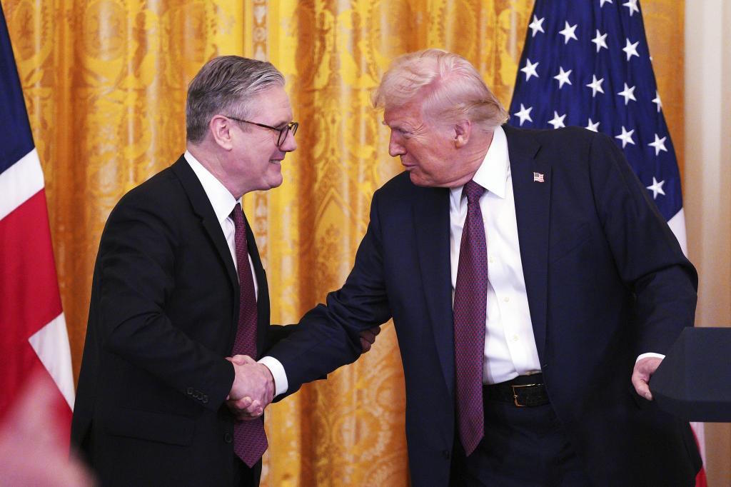 Britain's Prime Minister Starmer and U.S. President Trump shake hands.