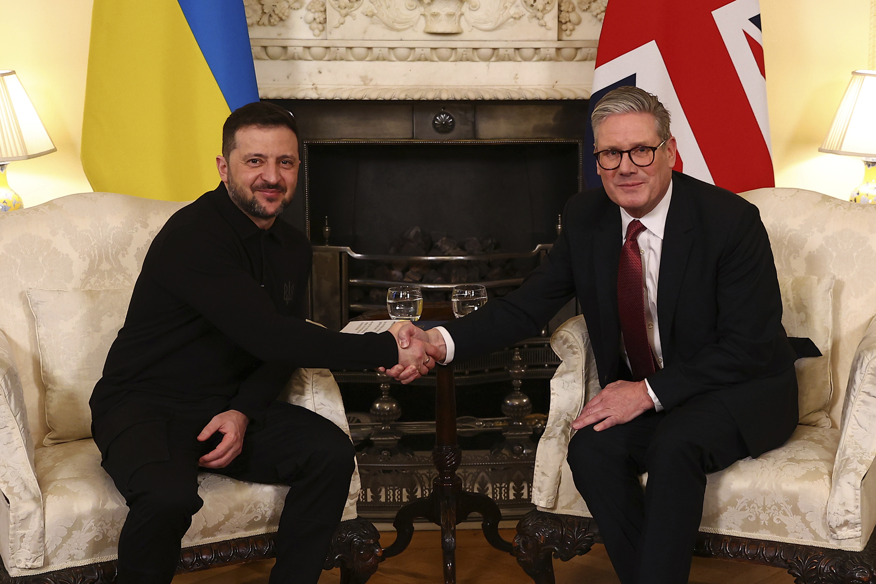 Britain's Prime Minister Keir Starmer, right, and Ukraine's President Volodymyr Zelenskyy, left, shake hands during a meeting at 10 Downing Street in London.