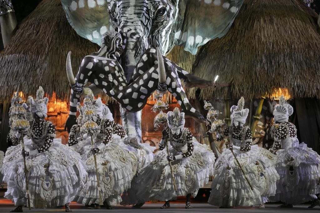 Performers from the Imperatriz Leopoldinense samba school dance during Carnival celebrations at the Sambadrome in Rio de Janeiro