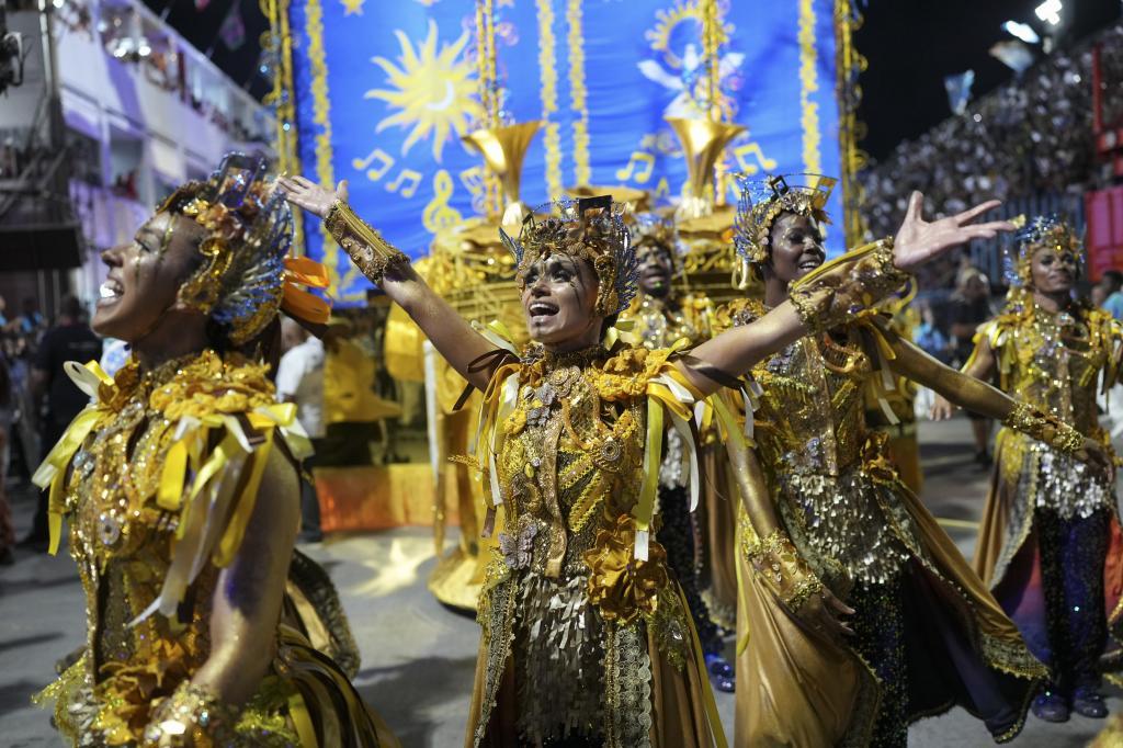 Performers from the Portela samba school parade during Carnival celebrations at the Sambadrome in Rio de Janeiro