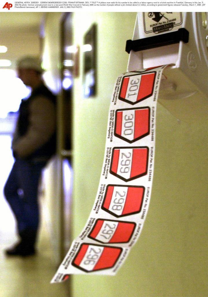 A jobless man waits for his number to be called in a labour agency