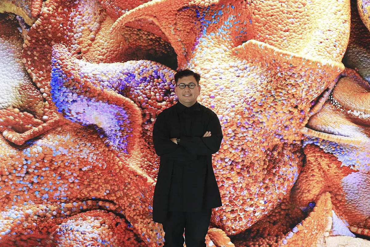 The artist, in front of 'Echoes of the Earth' (2024).