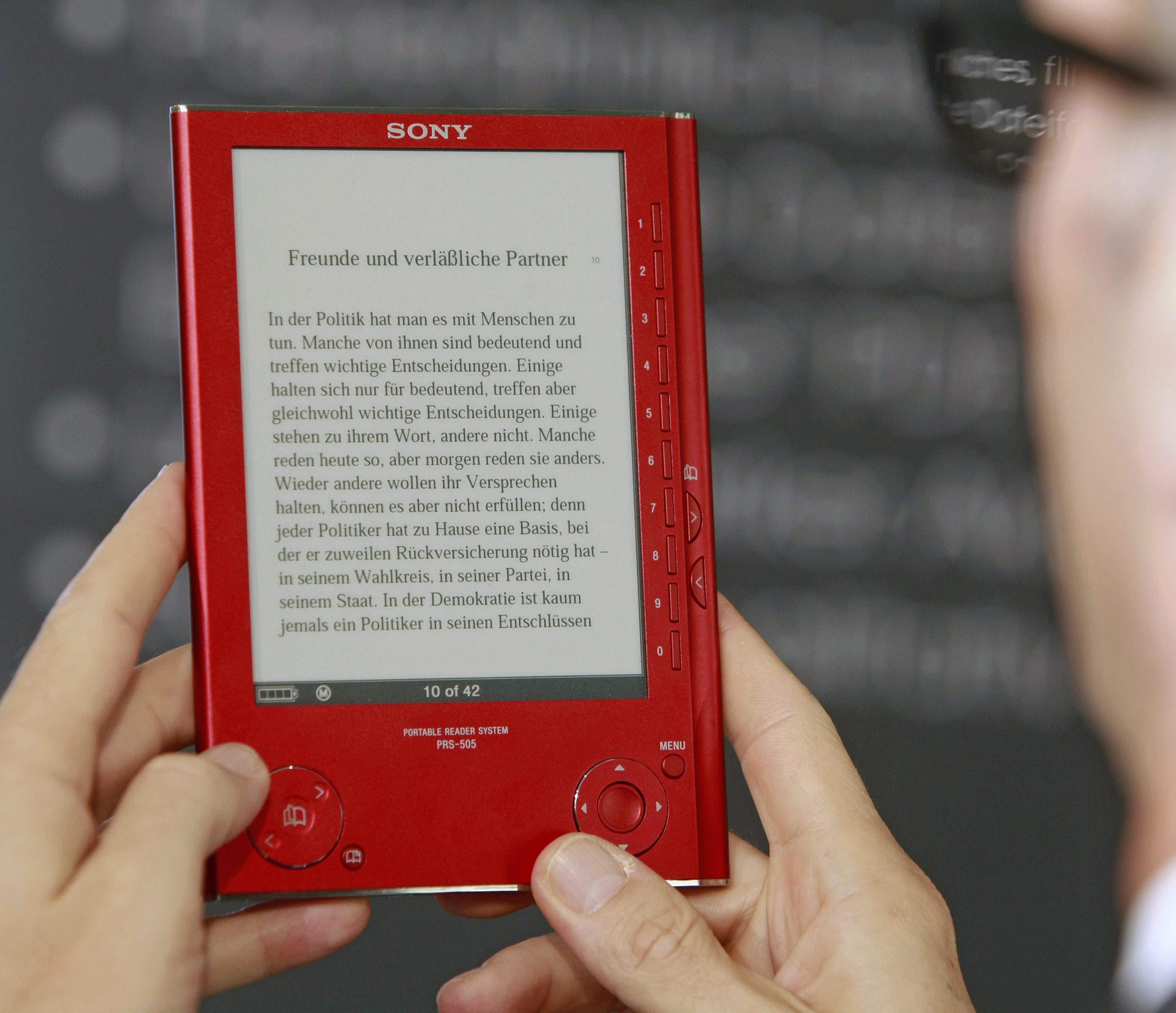 A man with a book during the International Book Fair of Frankfurt.