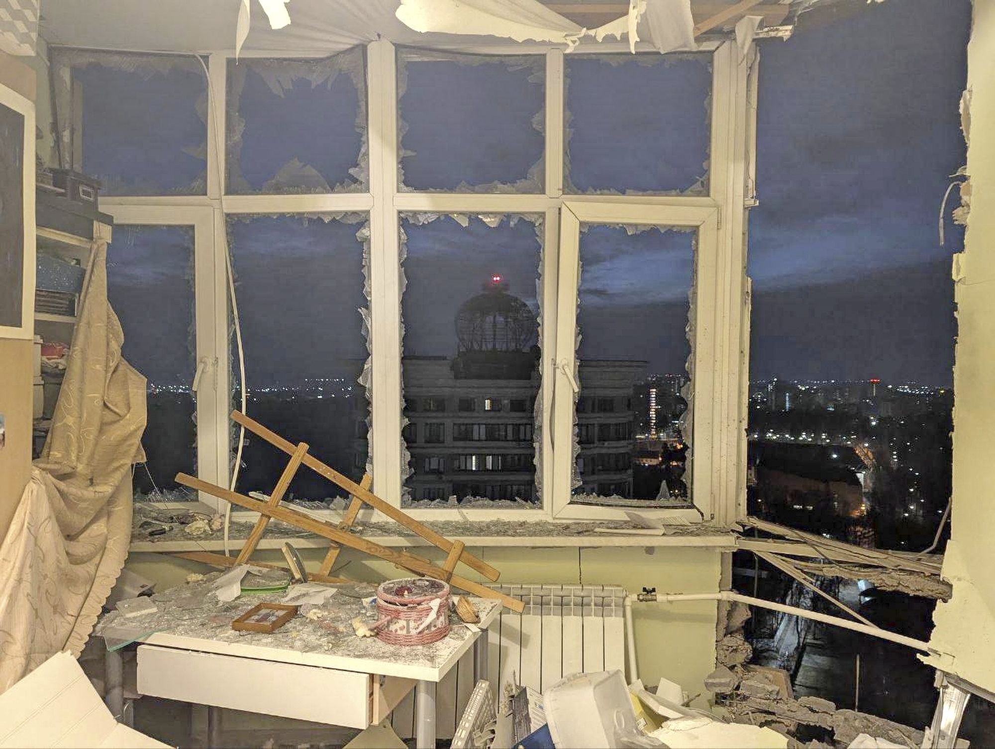 damaged apartment on the site where a shot down Ukrainian drone fell, outside Moscow, Russia.