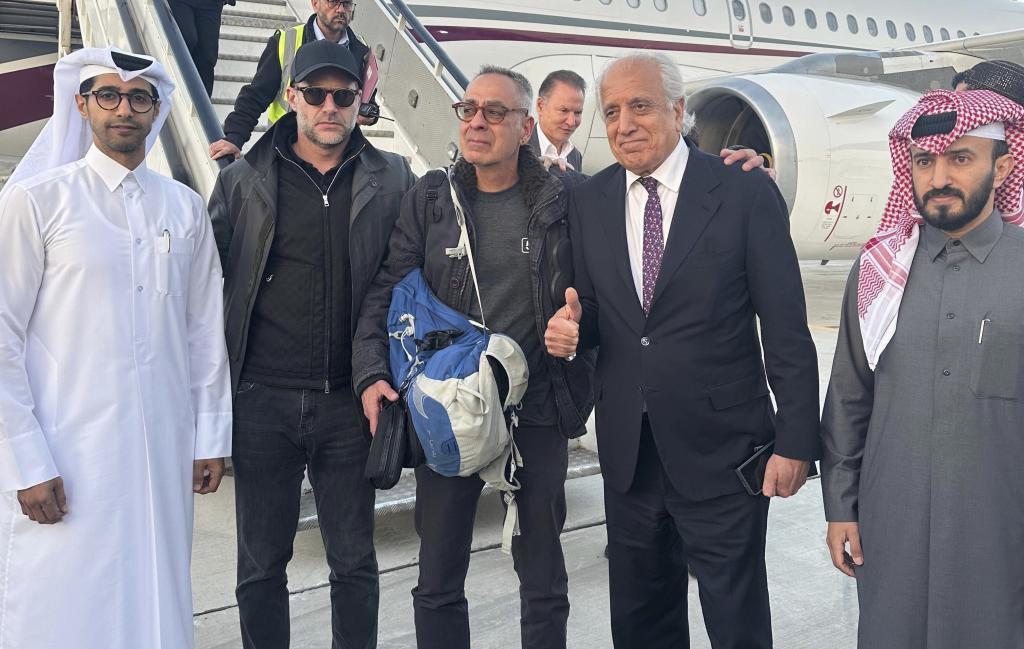 George Glezmann, center, poses with Adam Boehler, second left, and Zalmay Khalilzad, second right, and Qatari diplomats in Kabul.