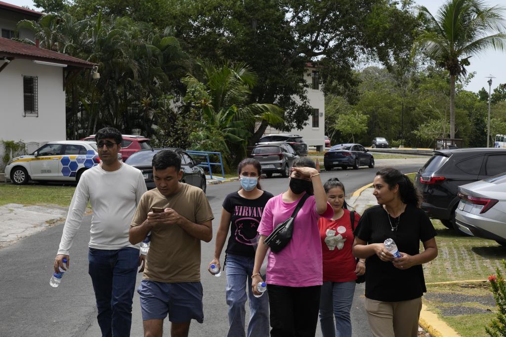 Afghan migrants deported from the U.S. wait outside the British Embassy in Panama City,