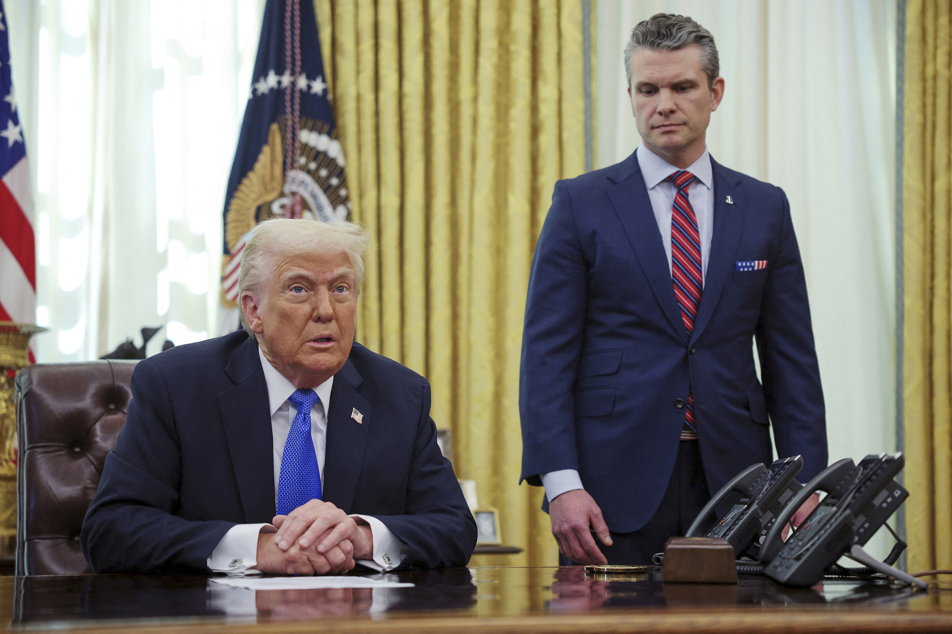 President Donald Trump, left, and Secretary of Defense Pete Hegseth.