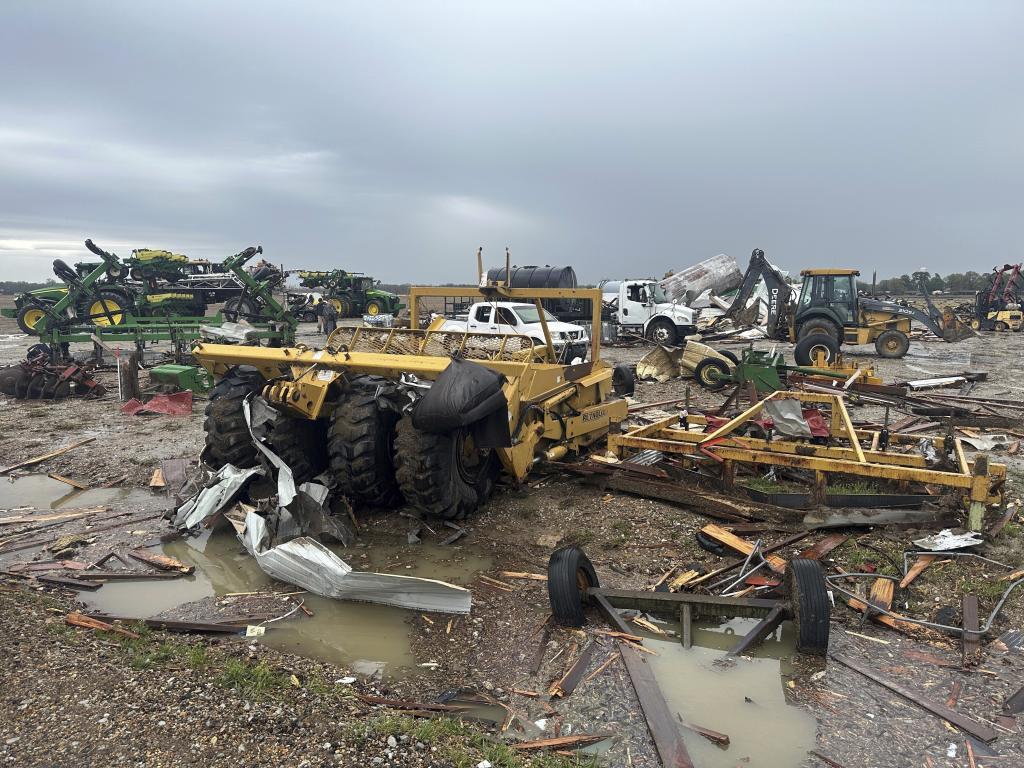 Damaged equipment sits on a farm struck