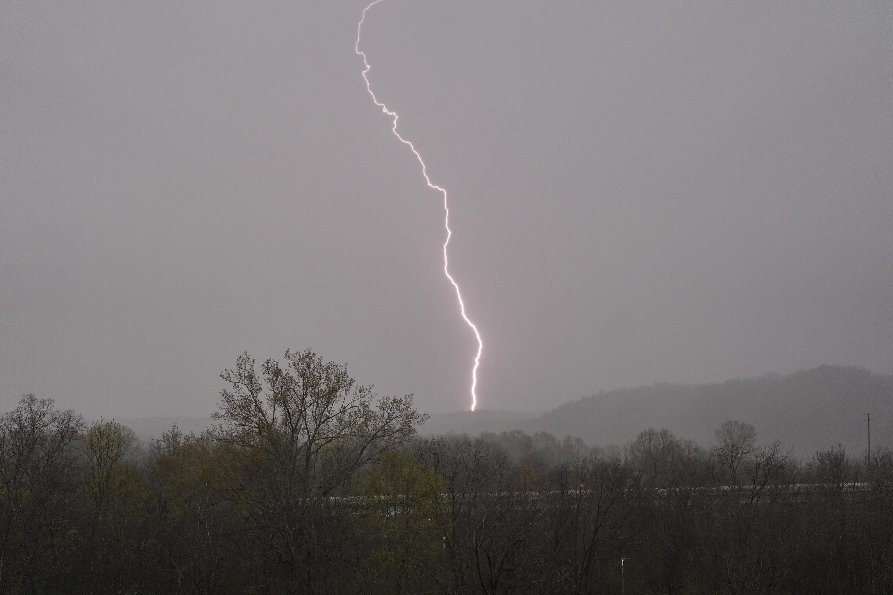 Lightning strikes as storms move through the area in Ashland City, Tenn.