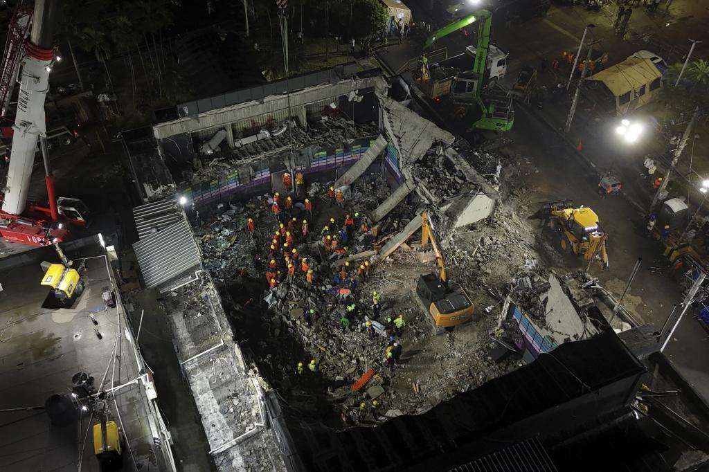 Rescue workers search for bodies at the Jet Set nightclub after its roof collapsed during a merengue concert in Santo Domingo