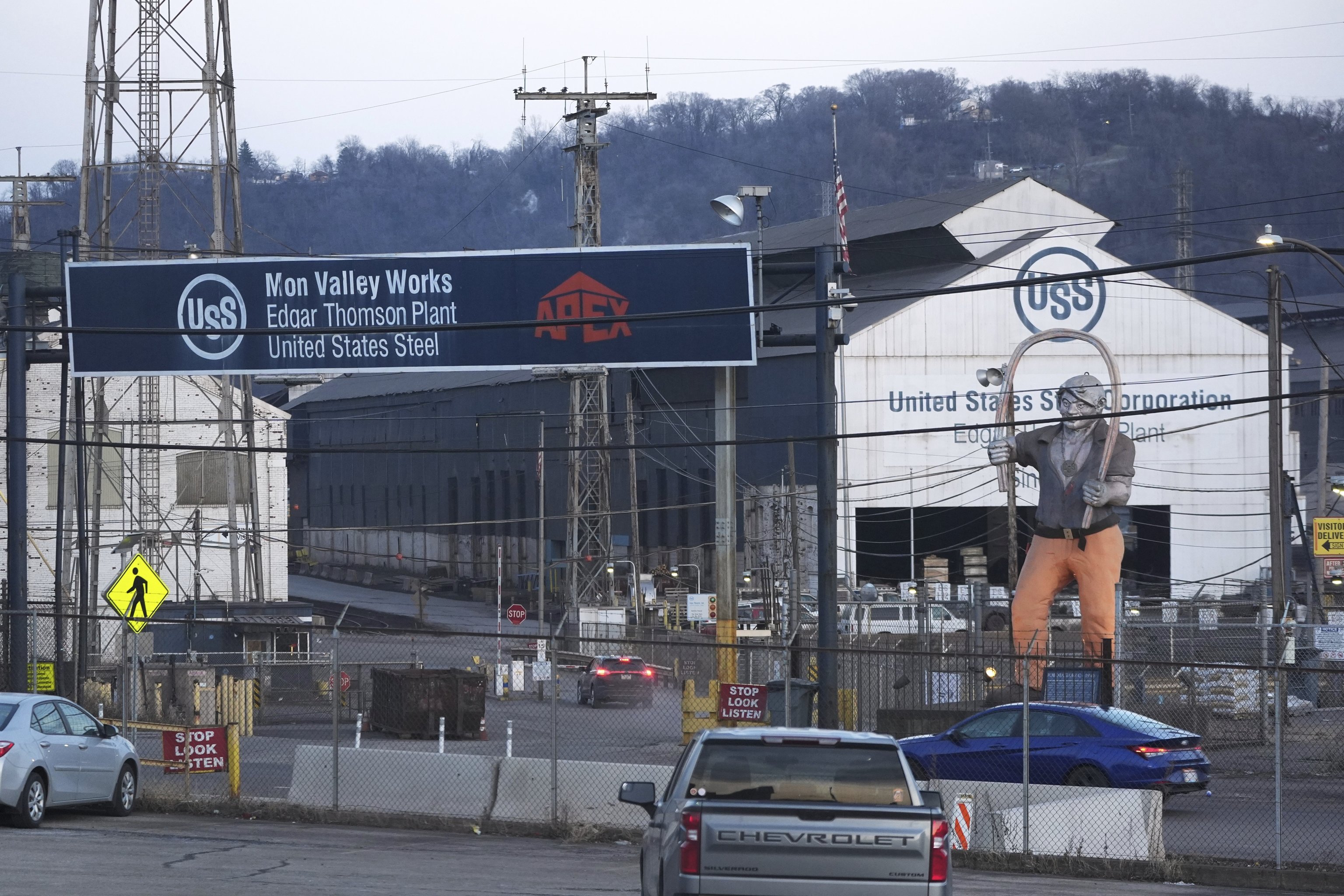 Cars sit parked outside the United States Steel Corporations Edgar Thomson Plant.