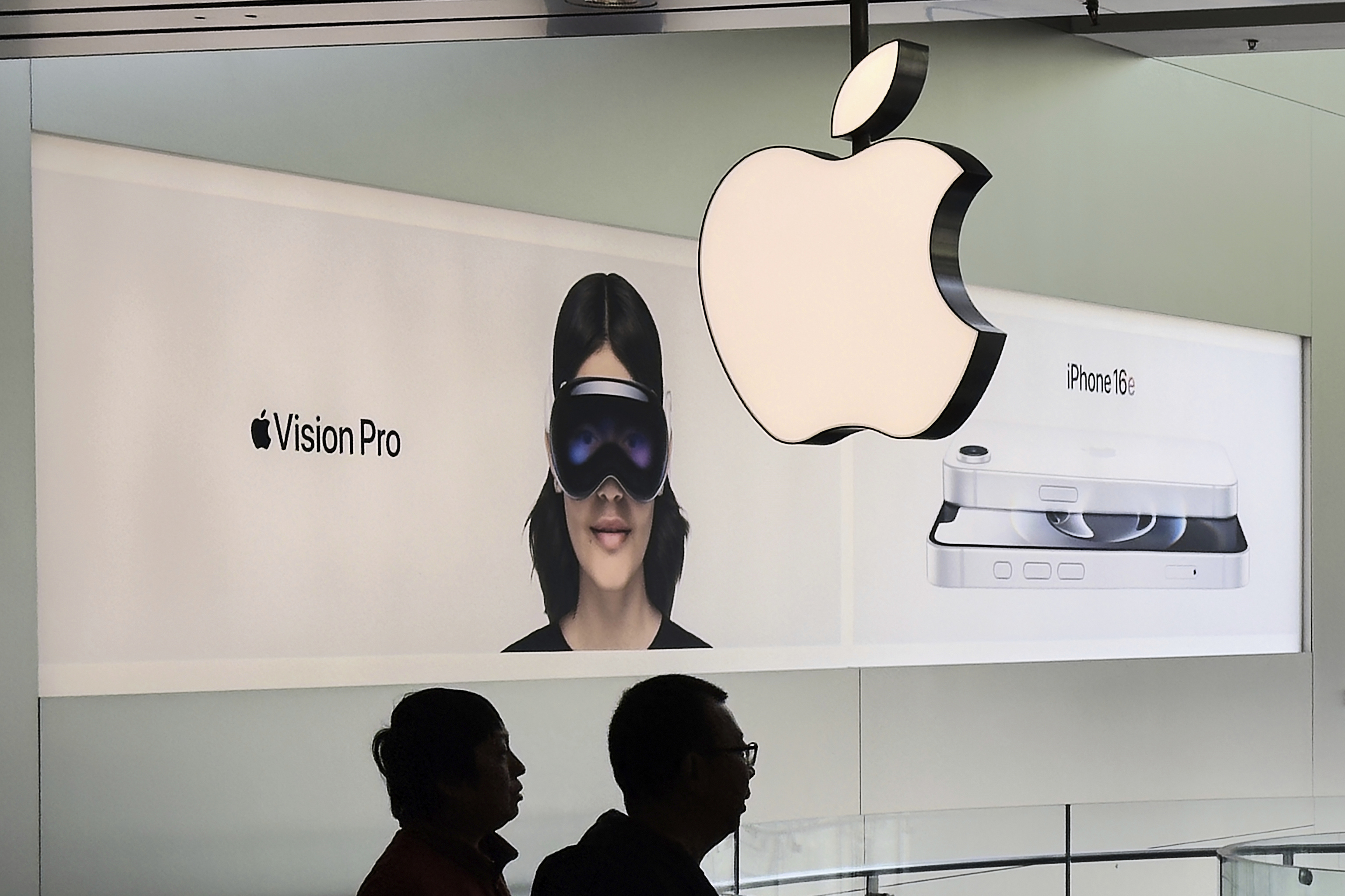 People visit an Apple store.