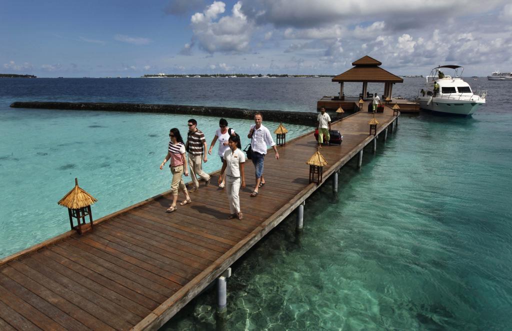Foreign tourists arrive in a resort in the Kurumba island in Maldives