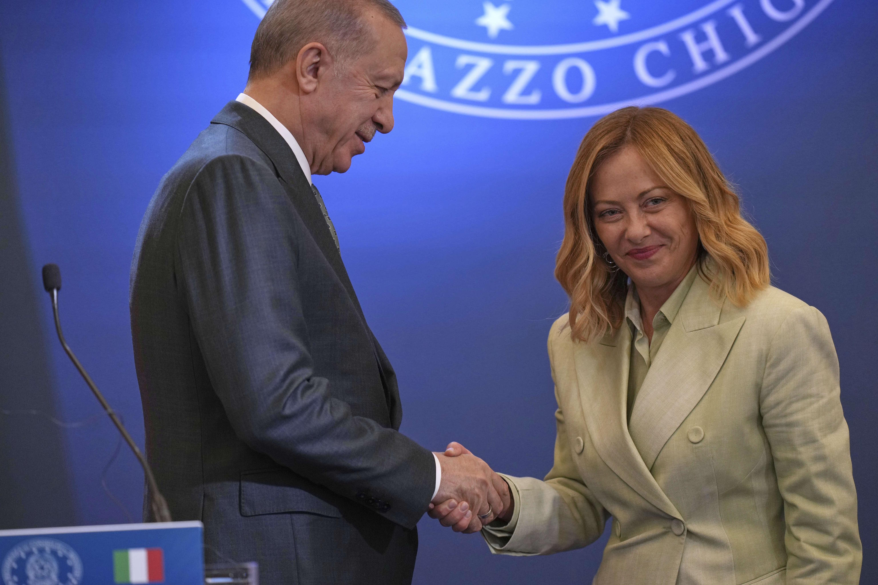 Turkish President Recep Erdogan, left, and Italian Premier Giorgia Meloni.