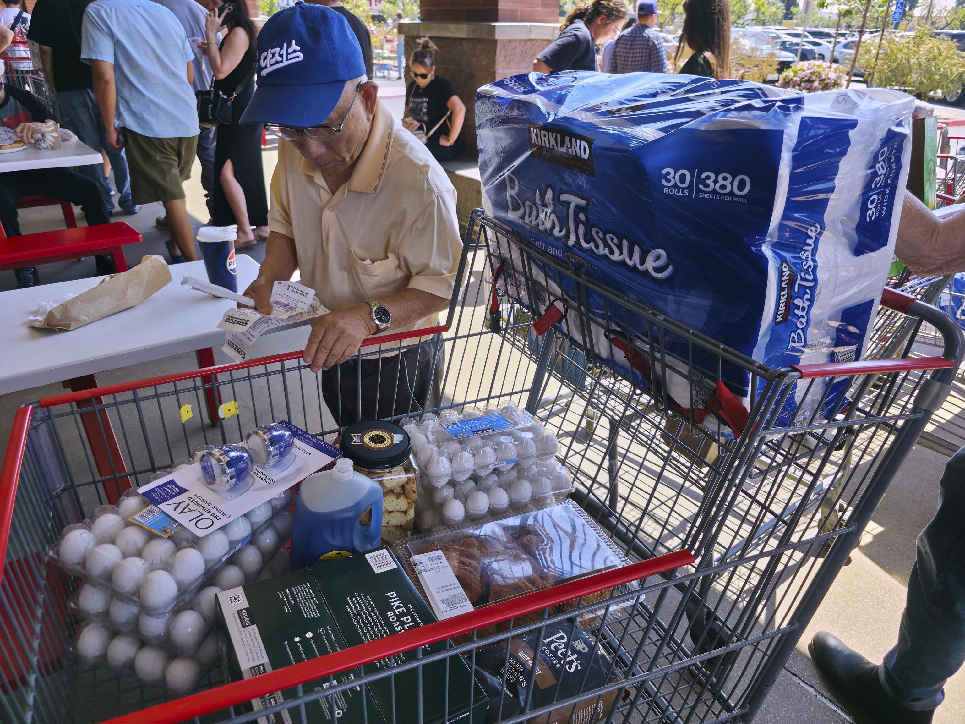 A customer checks his shopping receipts.