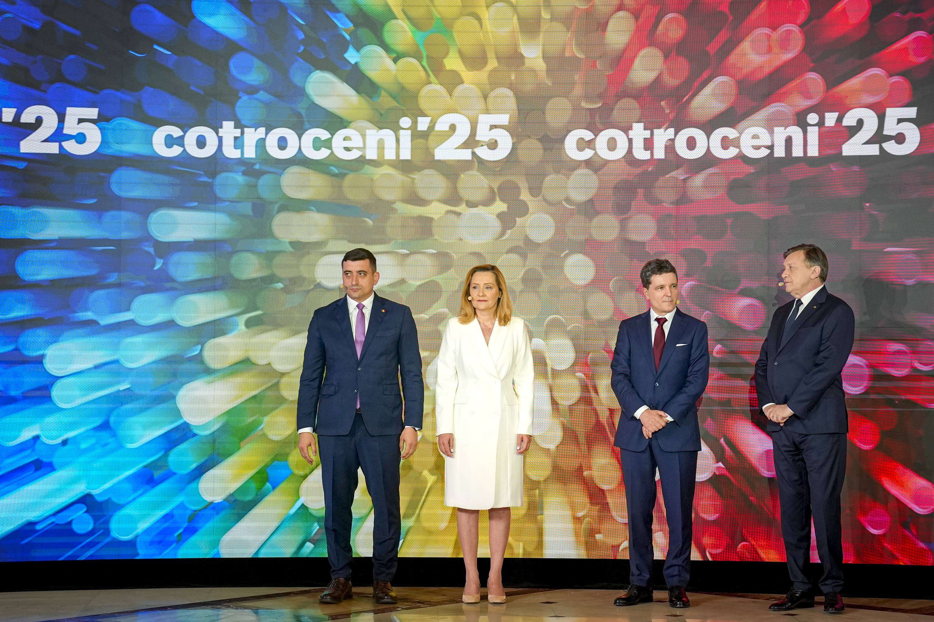 Romanian presidential candidates George Simion, left, Elena Lasconi, center left, Nicusor Dan, center right, and Crin Antonescu, right.