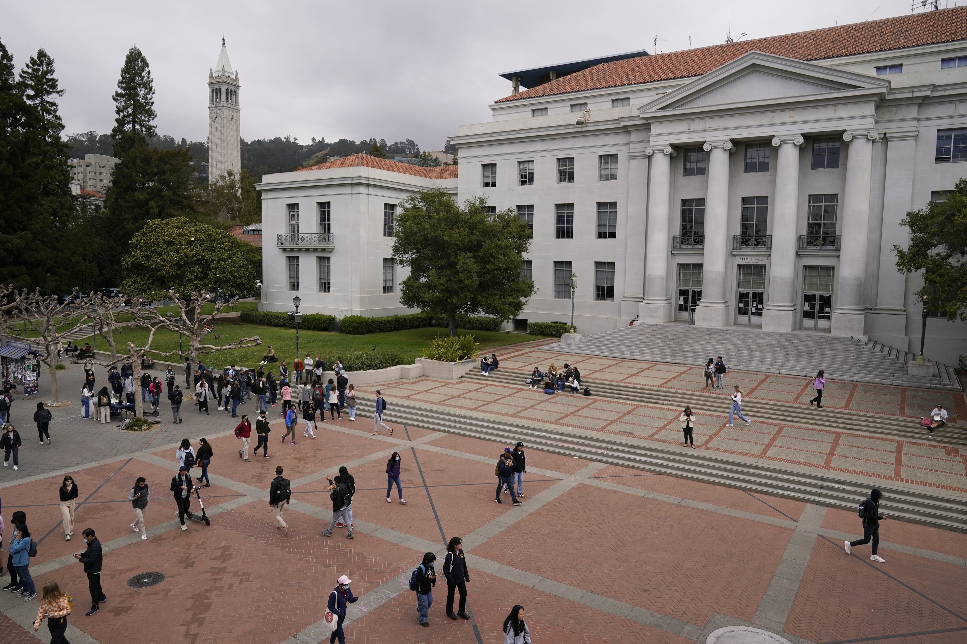 Students walk through Sproul Plaza on the University of California.