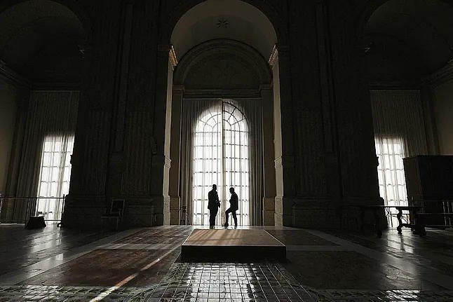Members of the Vatican security at the windows of the balcony of St. Peter's Basilica.