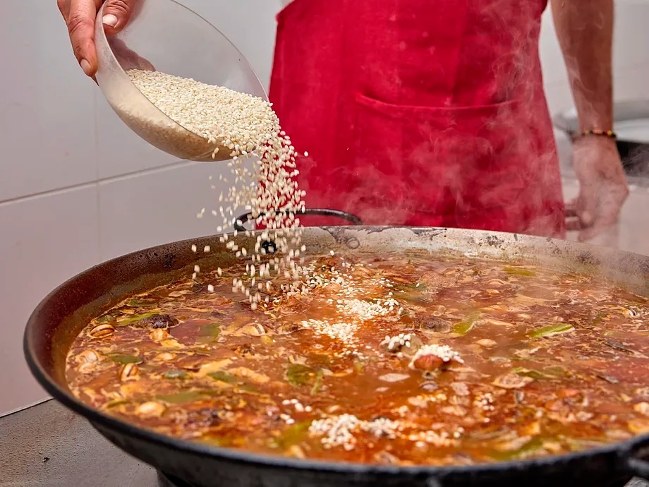 Preparing a paella for this report.