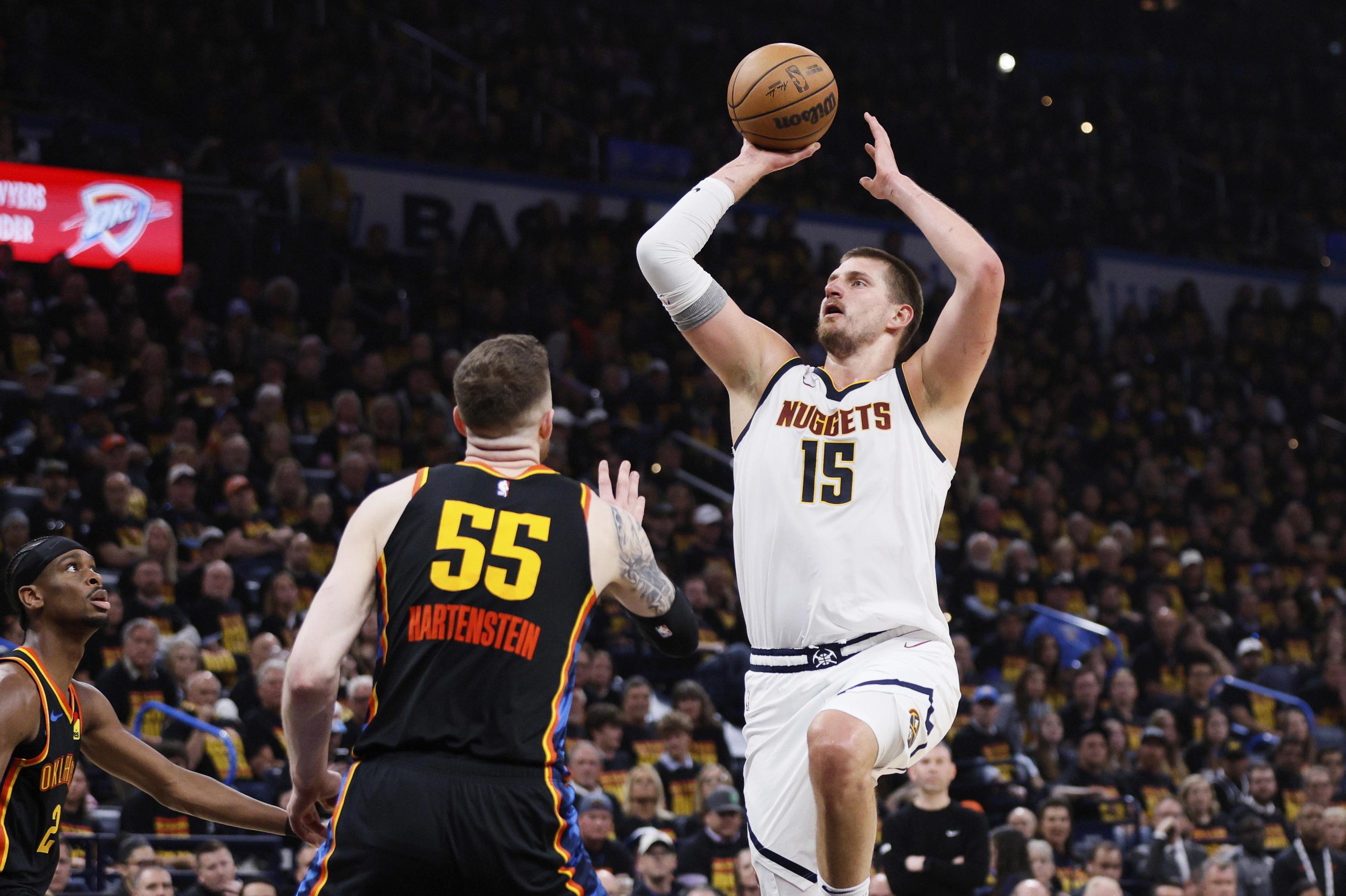 Denver Nuggets center Nikola Jokic leaps for a touchdown.