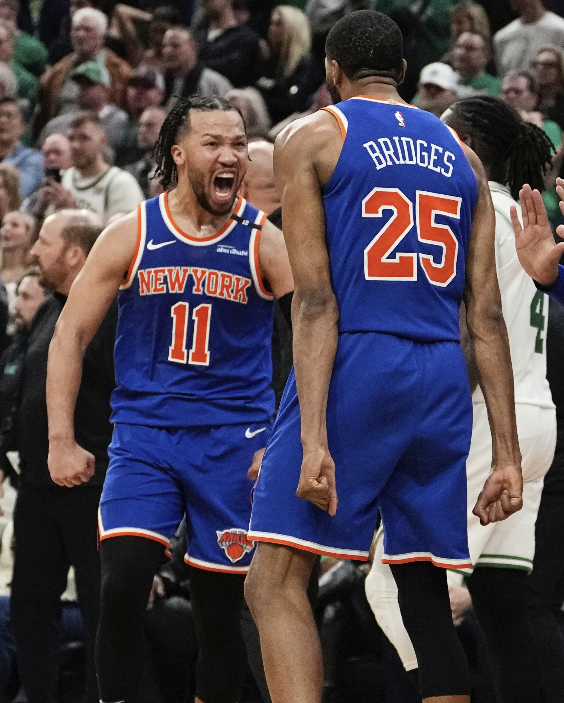 New York Knicks guard Jalen Brunson celebrates with Mikal Bridges.