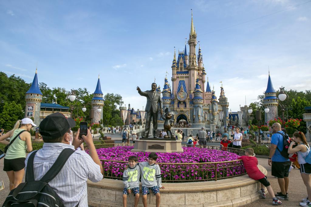 People visit the Magic Kingdom Theme Park at Walt Disney World Resort in Lake Buena Vista, Florida.