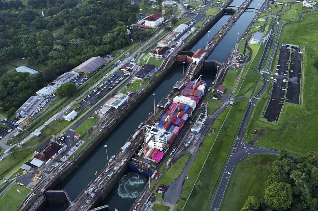 A cargo ship traverses the Agua Clara Locks of the Panama Canal in Colon