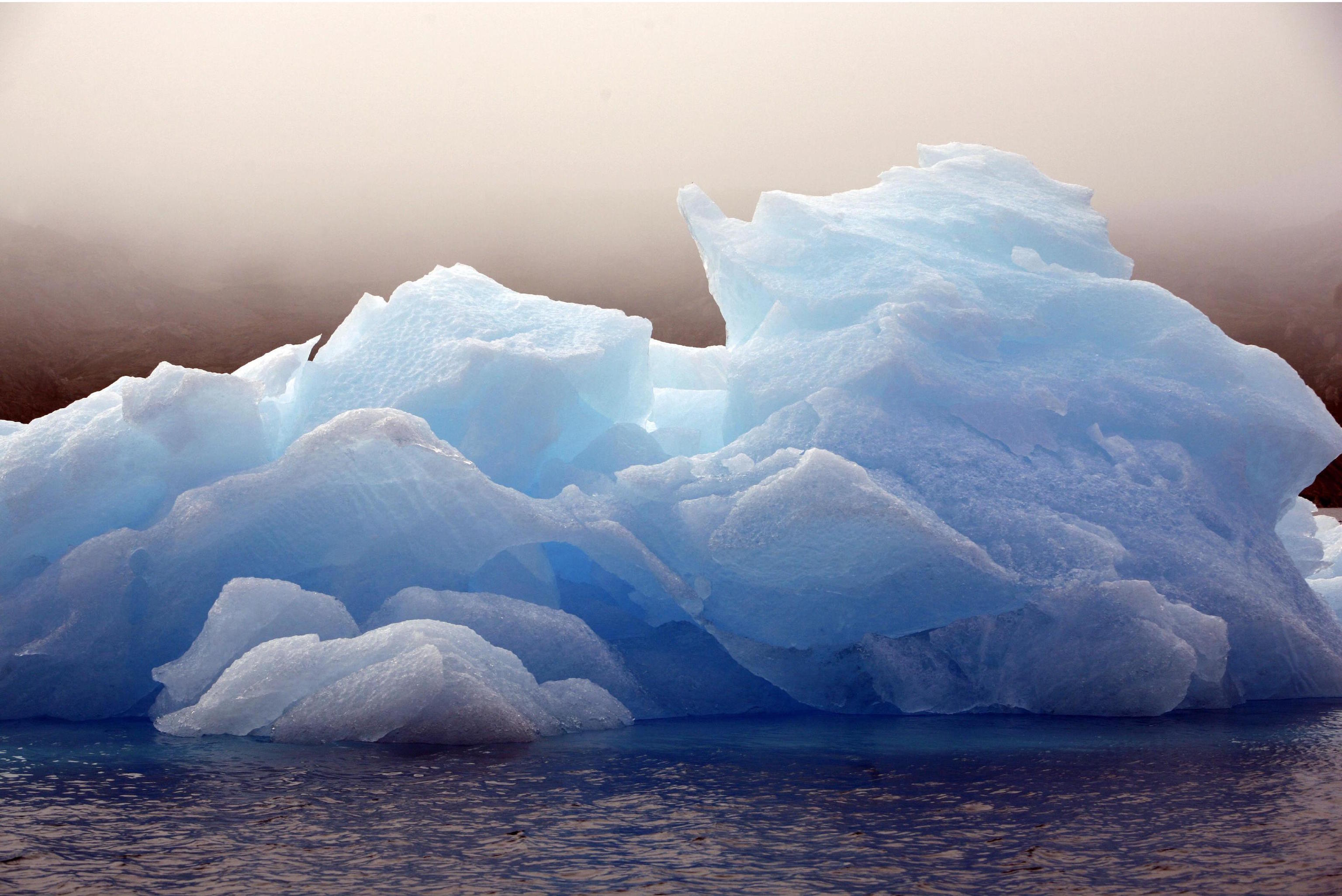 An iceberg floats in Greenland.