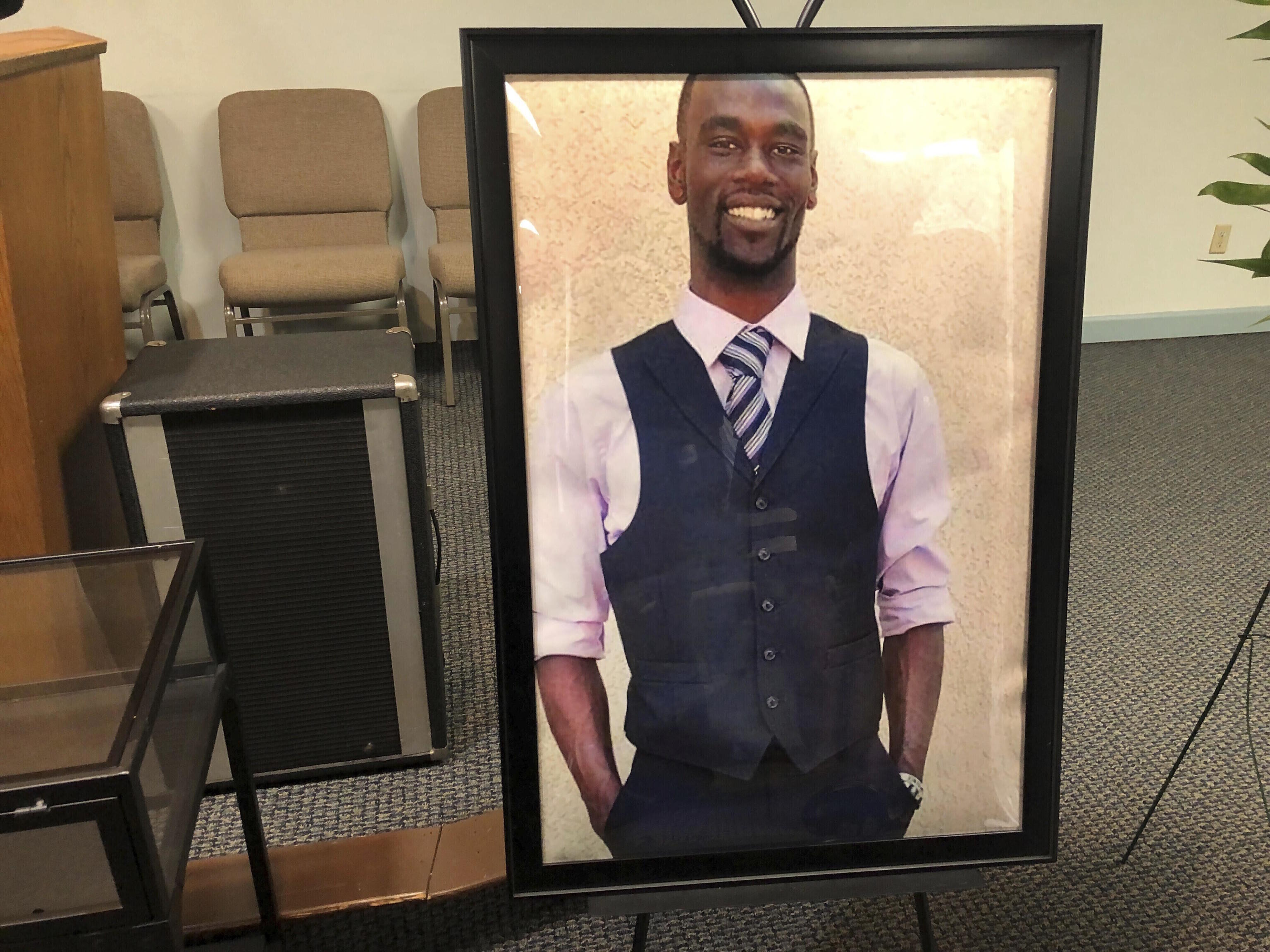 A portrait of Tyre Nichols at a religious ceremony in his honor.