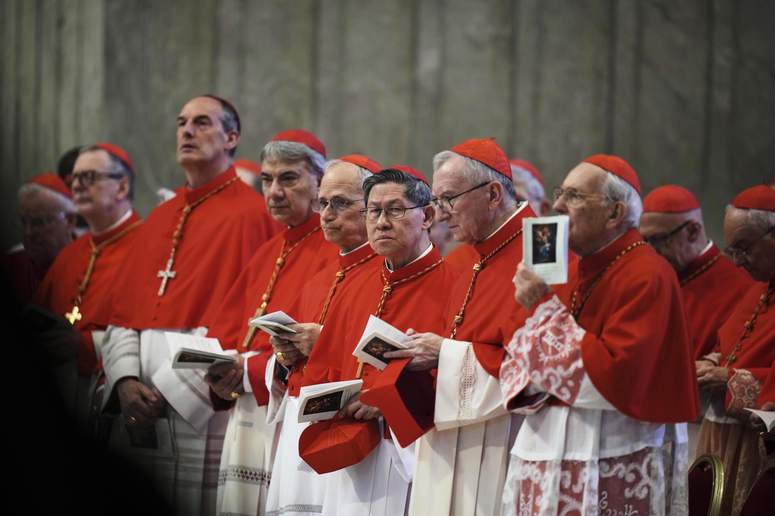 Cardinal Luis Antonio Tagle, center.