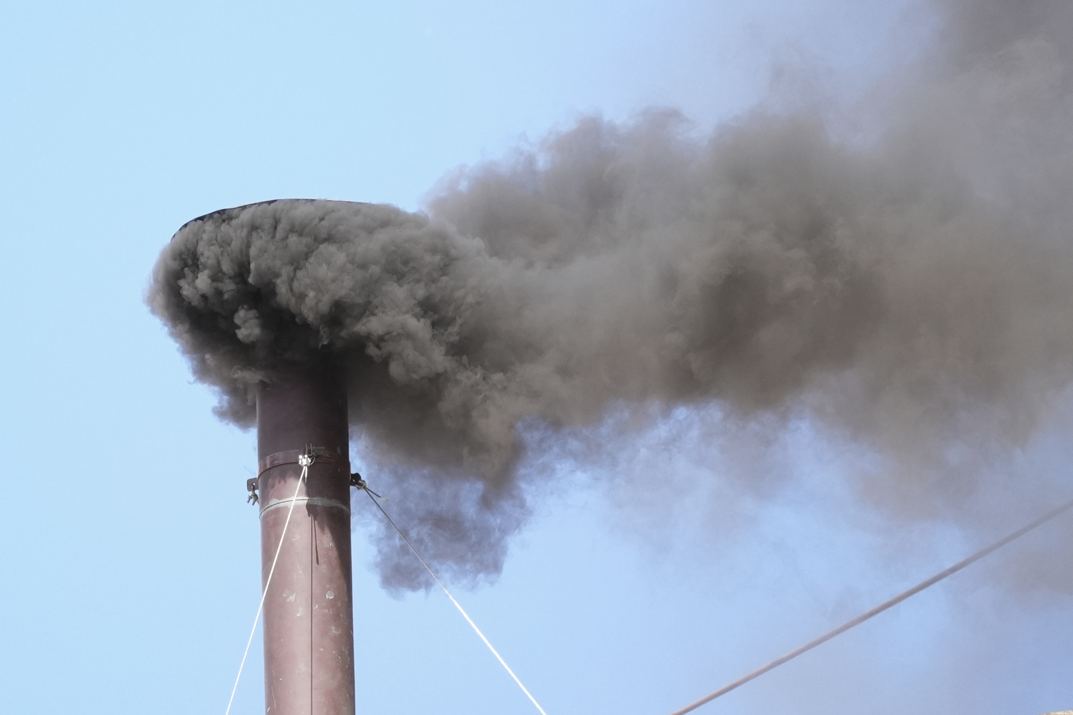Black smoke billows from the chimney of the Sistine Chapel during the conclave to elect a new pope.