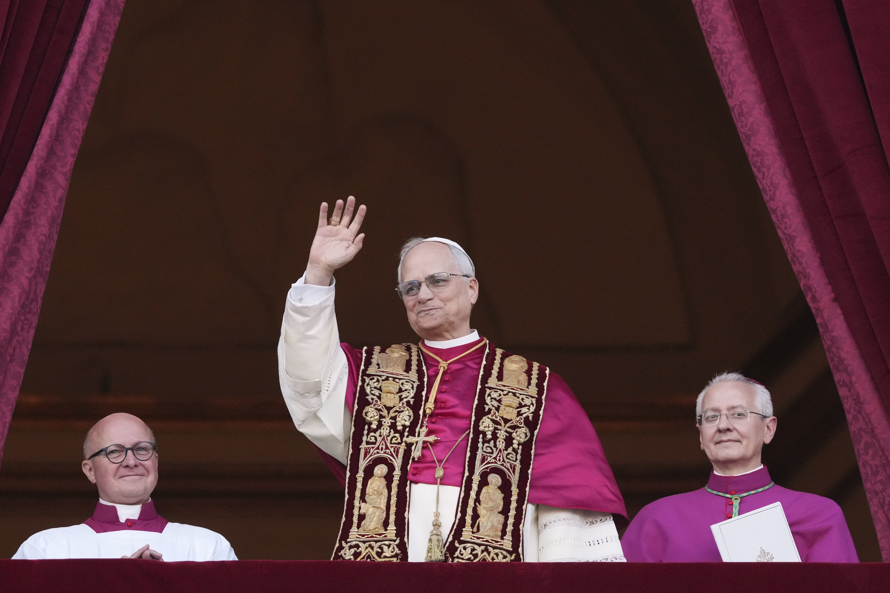 Cardinal Robert Prevost appears on the central loggia of St. Peter's Basilica after being chosen the 267th pontiff.