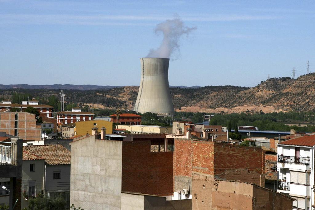 The Asco I nuclear power station, center, is seen near houses in the small town of Asco, Spain