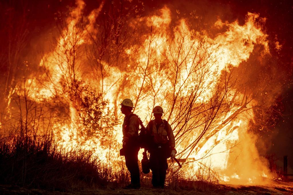 Fire crews battle the Kenneth Fire in the West Hills section of Los Angeles