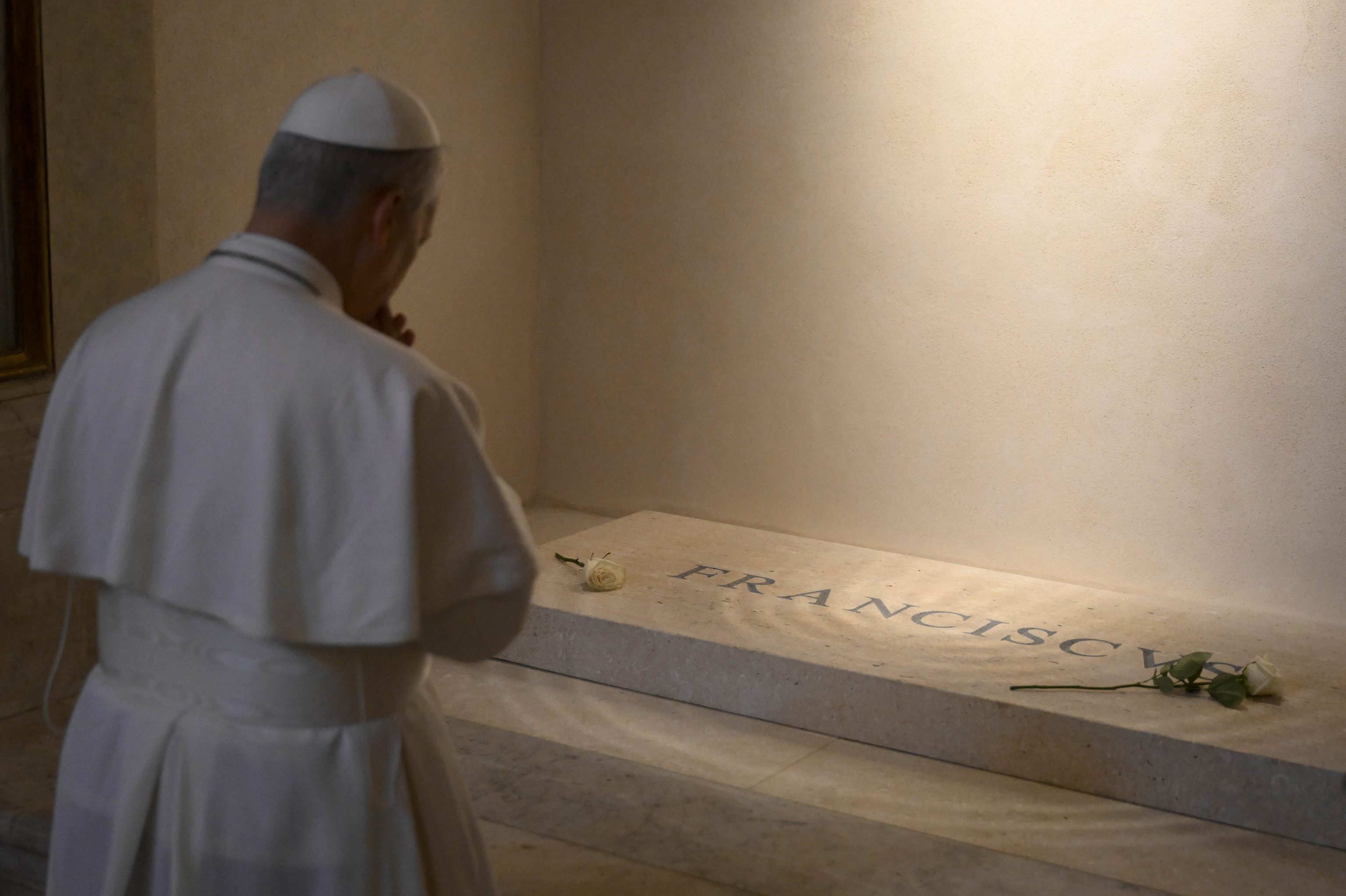 Pope Leo XIV prays on the tomb of late Pope Francis in St. Mary Major Basilica in Rome.