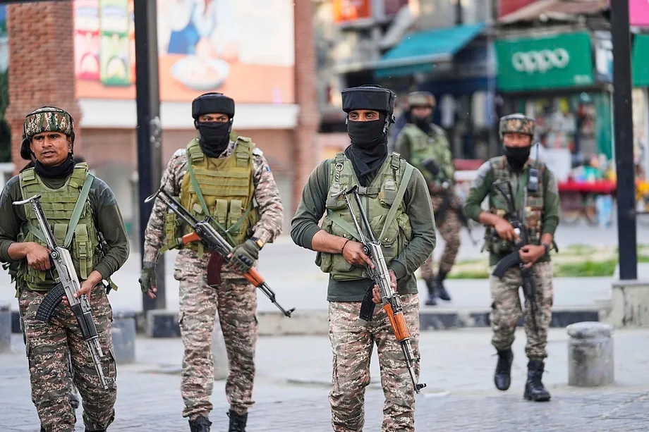 Indian soldiers keep watch in a market in Srinagar, in Indian Kashmir.