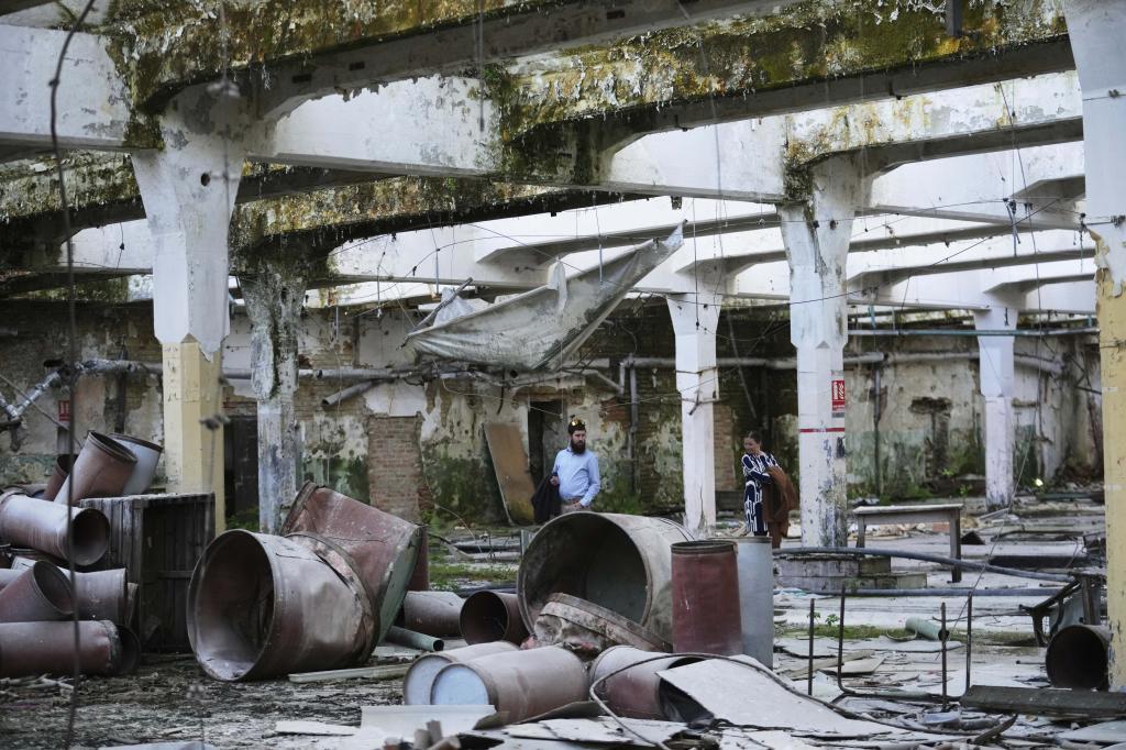 Visitors observe the Museum of Survivors, located in a factory where Oskar Schindler saved some 1200 Jews during the WWII,
