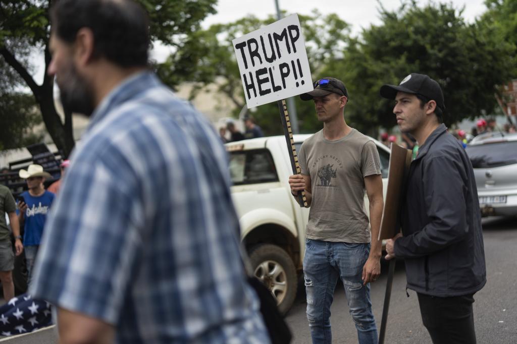 White South Africans demonstrate in support of U.S. President Donald Trump in front of the U.S. embassy in Pretoria