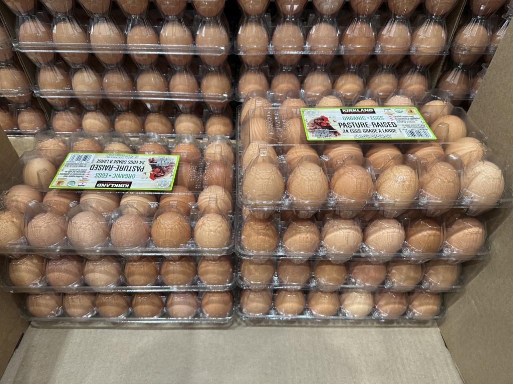 Flats of eggs sit on display in a Costco.