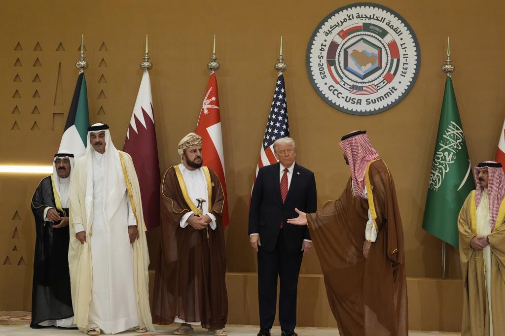 Saudi Crown Prince Mohammed bin Salman, right, welcomes President Donald Trump for the group photo with Gulf Cooperation Council leaders