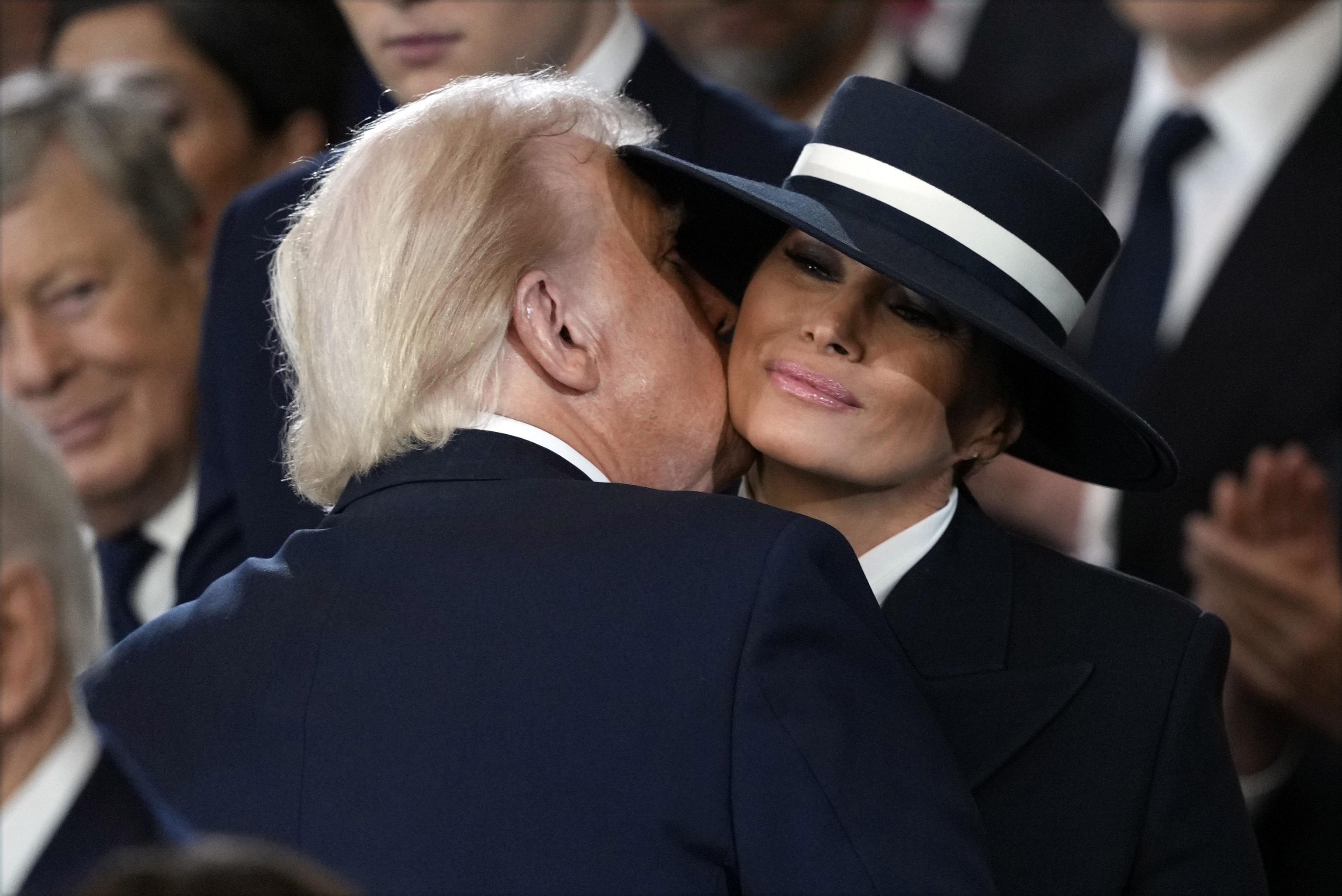 President Donald Trump kisses his wife first lady Melania Trump.