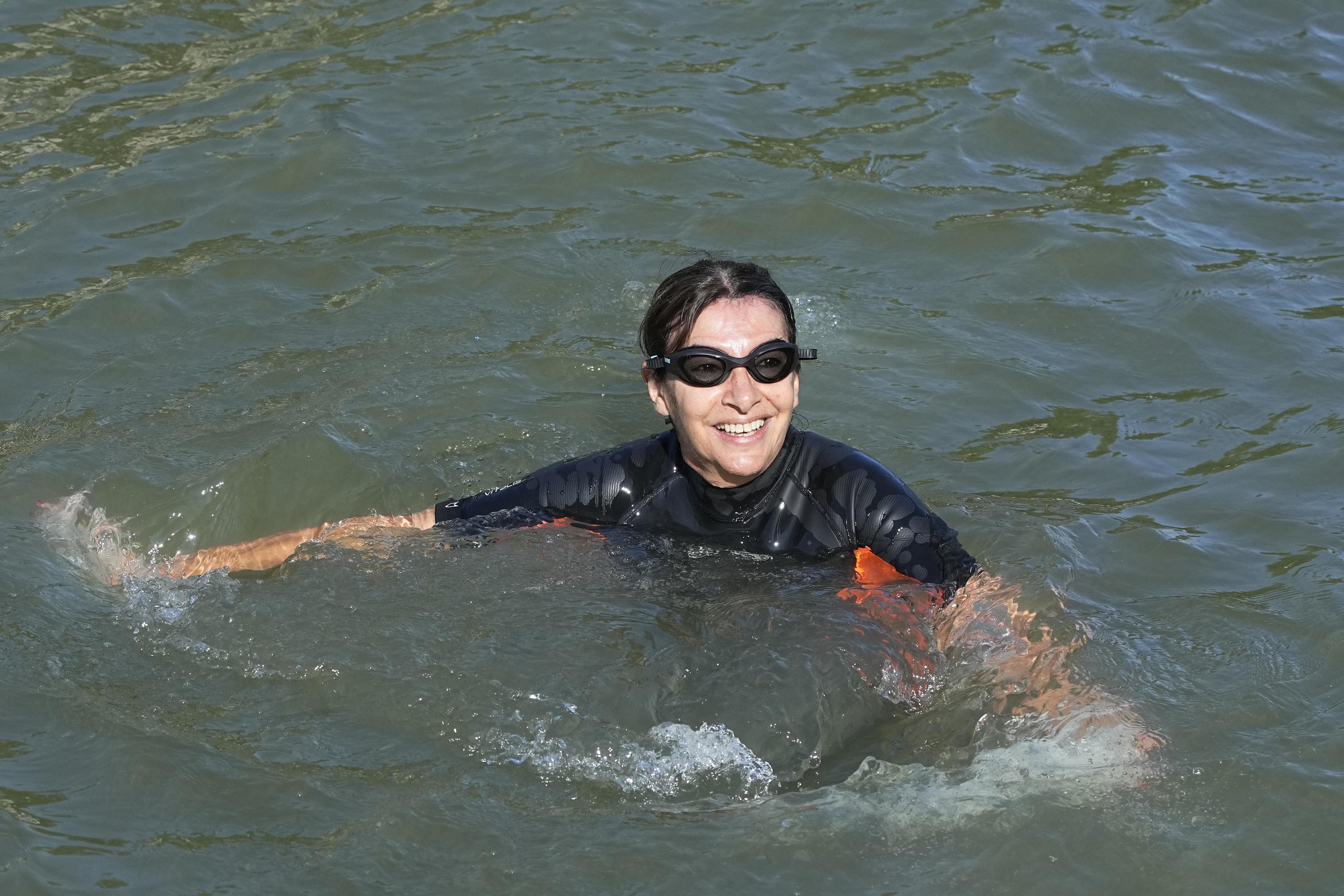 Paris Mayor Anne Hidalgo swims in the waters of the Seine River.